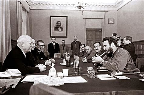 PHOTO: Fidel Castro, wearing 2 Rolexes, lighting a cigar while .